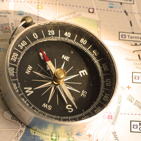 An old compass and the travelling map guide の写真素材
