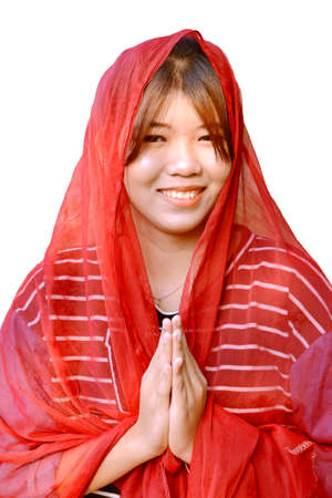 Asian teenager wearing red saree on her head isolated on white background の写真素材