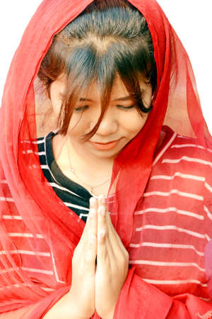 Asian teenager wearing red saree on her head isolated on white background の写真素材