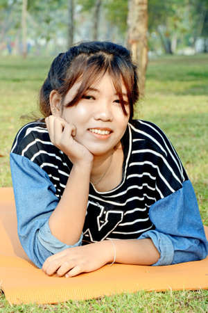 Portrait of happy young beautiful Asian woman の写真素材