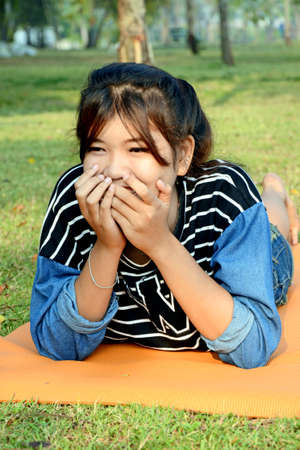 Portrait of happy young beautiful Asian woman の写真素材