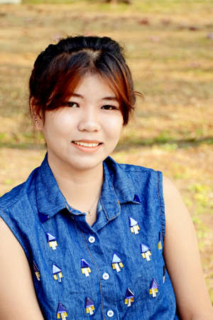 Portrait of smiling young beautiful Asian woman の写真素材