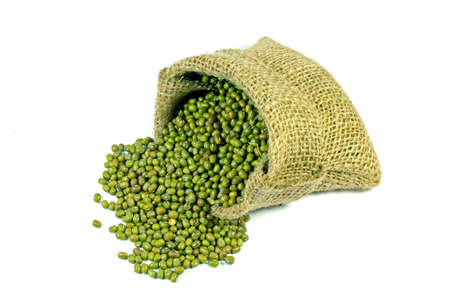 Little sack of green mung beans mon white background の写真素材