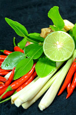 Ingredients for Thai cuisine Tom Yum include lemongrass stem, lemon juice, galanga root, chili and kaffir lime leavesの写真素材
