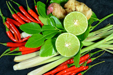 Ingredients for Thai cuisine Tom Yum include lemongrass stem, lemon juice, galanga root, chili and kaffir lime leavesの写真素材