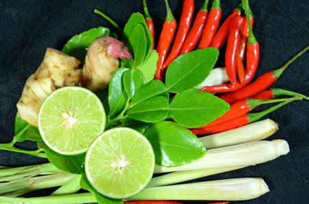 Ingredients for Thai cuisine Tom Yum include lemongrass stem, lemon juice, galanga root, chili and kaffir lime leavesの写真素材