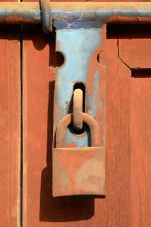 Rust lock on wooden door  The old style of door lock almost found in Asia house and building の写真素材