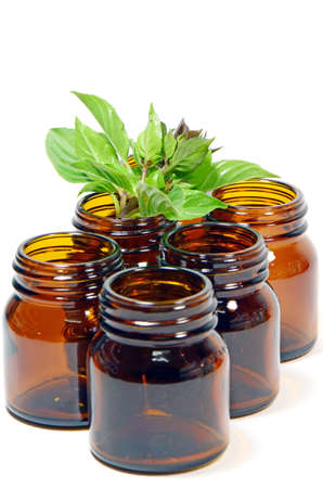 Green Concept of Reduce, Reuse and Recycle with The Amber Glass Bottles on White Background の写真素材