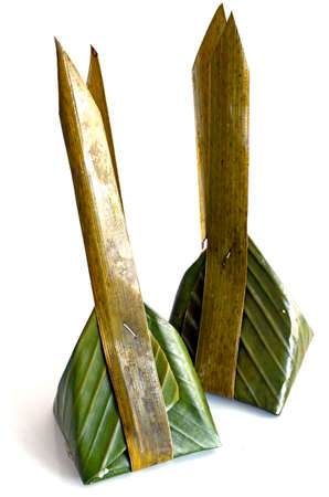 Thai dessert in banana leaf container in Thai s style isolated on white background の写真素材