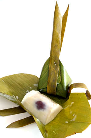 Thai dessert in banana leaf container in Thai s style isolated on white background の写真素材