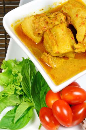Spicy Pork Rib Curry with Tumeric Root Served with Fresh Vegetable, Tomatoes and Streamed Rice の写真素材