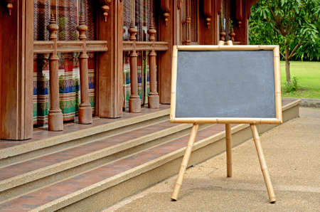 Empty Chalkboard with Bamboo Wood Stand Outdoor の写真素材