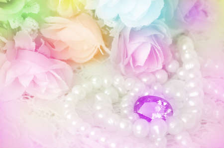 Bouquet, Jewelry and Pearls Necklace with Soft Focus Color Filtered as Background の写真素材
