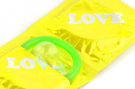 Latex Condom on White Background.の写真素材