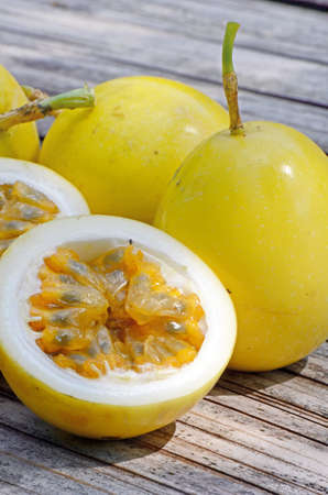 Yellow passion fruit (Passiflora edulis) on natural background.の写真素材