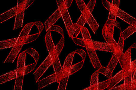 World Aids Day Red Ribbon Sign on Black Background.の写真素材