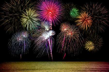 Firework celebration from the sea shore.の写真素材