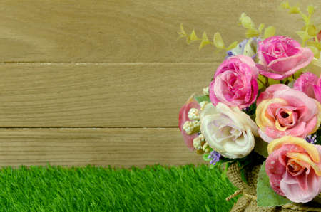 Colorful Flowers Bouquet Decorated on Old Wood and Turf Background.の写真素材