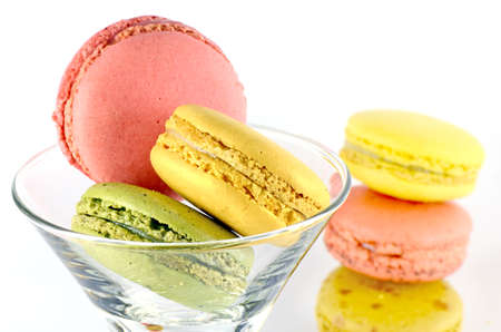 Sweet Macaroons in Cocktail Glass Isolated on White Background.の写真素材