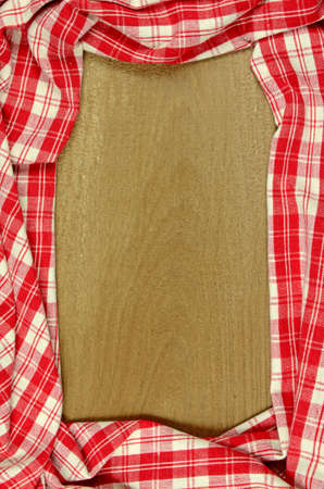 Red Table Cloth with Old Wooden Table Background.の写真素材