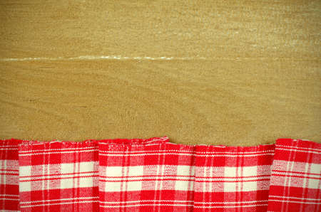 Collection of Thai Handmade Tablecloth Made from Cotton and Silk Display on Old Wood Table Surface as Background.の写真素材