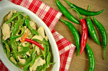 Stir Fried Chicken Breast with Green Organic Cayenne Pepper (Capsicum annuum Linn. Var acuminatum Fingerh.) in Chinese Style.の写真素材