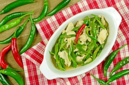Stir Fried Chicken Breast with Green Organic Cayenne Pepper (Capsicum annuum Linn. Var acuminatum Fingerh.) in Chinese Style.の写真素材