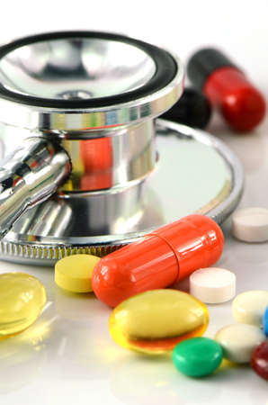 Stethoscope and Colorful of oral medications on White Background.の写真素材