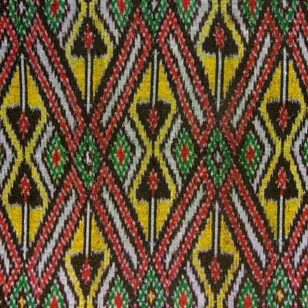 Cross stitch embroidery on canvas.