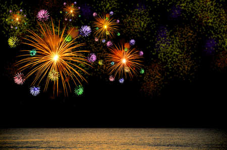 Firework celebration on dark background over the Sea.の写真素材
