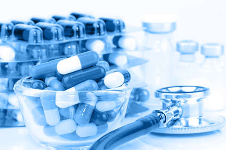 Oral medications, Sterile Vials and Stethoscope on White Background.の写真素材