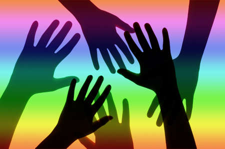 Silhouette of Hands on Rainbow Background.の写真素材
