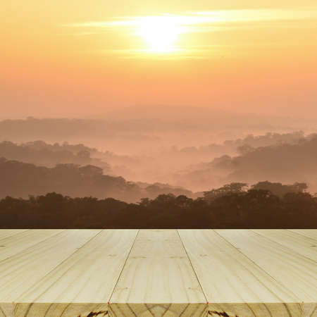 Blurred Sunrise Background and Mountain Landscapewith with Perspective Wood Window View.の写真素材