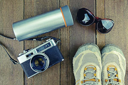 Travelling set with wood background in vintage look.の写真素材