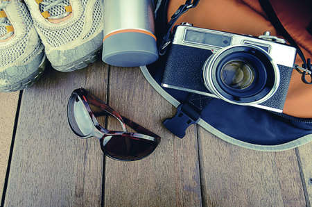 Travelling set with wood background in vintage look.の写真素材
