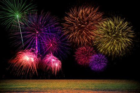 Firework celebration from the sea shore.の写真素材