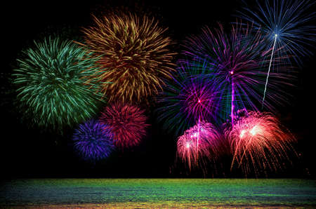 Firework celebration from the sea shore.の写真素材