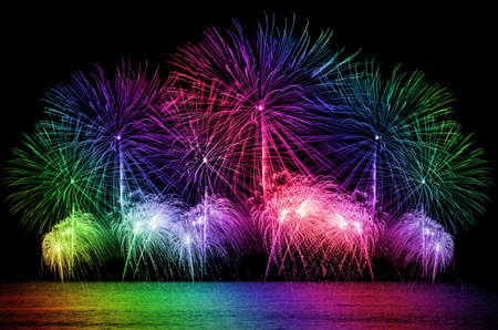 Firework celebration from the sea shore.の写真素材