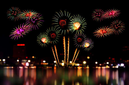 Colorful fireworks celebration and the city night light background.の写真素材