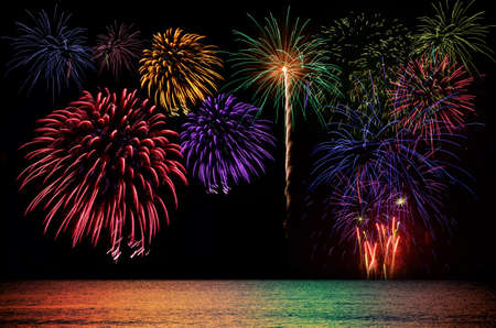 Colorful fireworks celebration and the city night light background.の写真素材