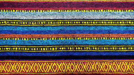 Cross stitch embroidery on canvas.Tribal handmade woven cotton fabrics form Chiengmai, Thailand. Pattern for design element.の写真素材