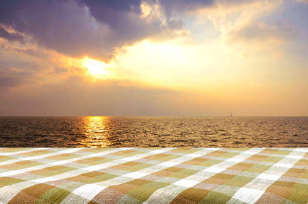 Outdoor Picnic Background with Picnic Table in the Evening Light.の写真素材