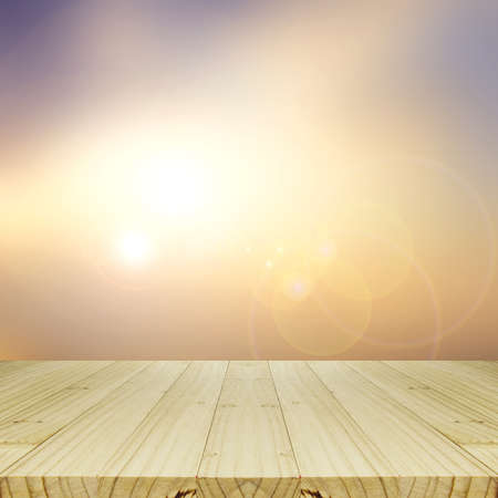 Wood Table and Blurred Sunrise Background.の写真素材