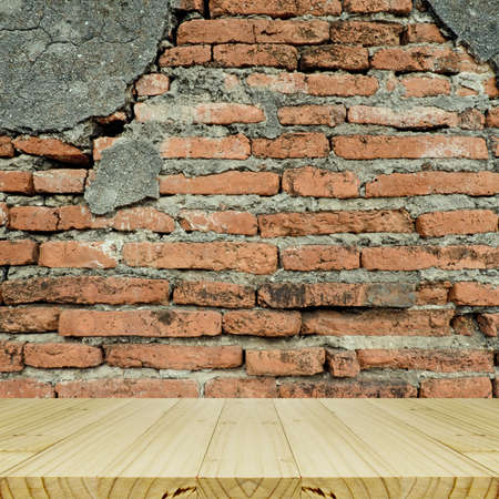 Plain Wood Table With Hipster Brick Wall Background.の写真素材