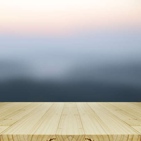 Wood Table and Blurred Sunrise Background.の写真素材