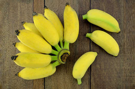 Cultivated Banana (Musa sapientum Linn.) on Natural Wood Background.の写真素材