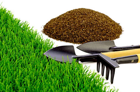 Small Gardening Tools and Artificial Turf Isolated on White Background.の写真素材