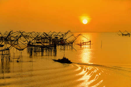 Morning sunrise withThai folk fishery style at Pakpra, Pattalung, Southern, Thailand.の写真素材