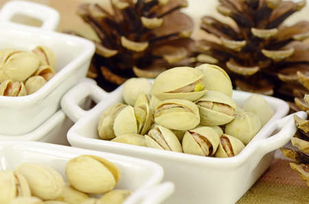 Roasted Pistachio in Closed-up in Small Ceramic Cup.の写真素材