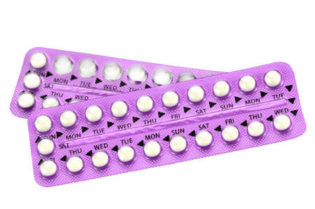 Colorful oral contraceptive pill strips isolated on white backgroundの写真素材